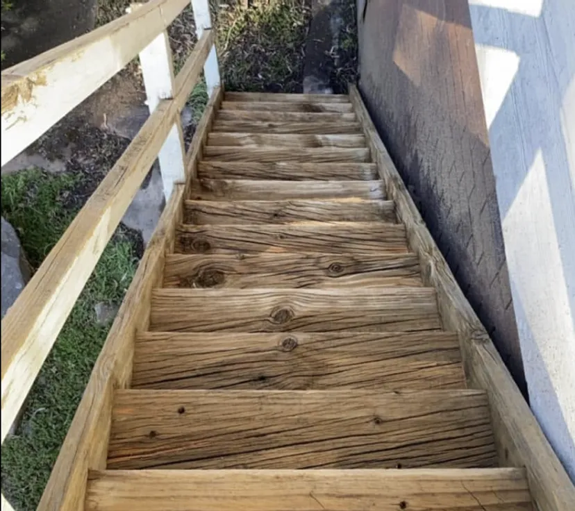 Timber staircase after pressure cleaning — natural wood grain restored